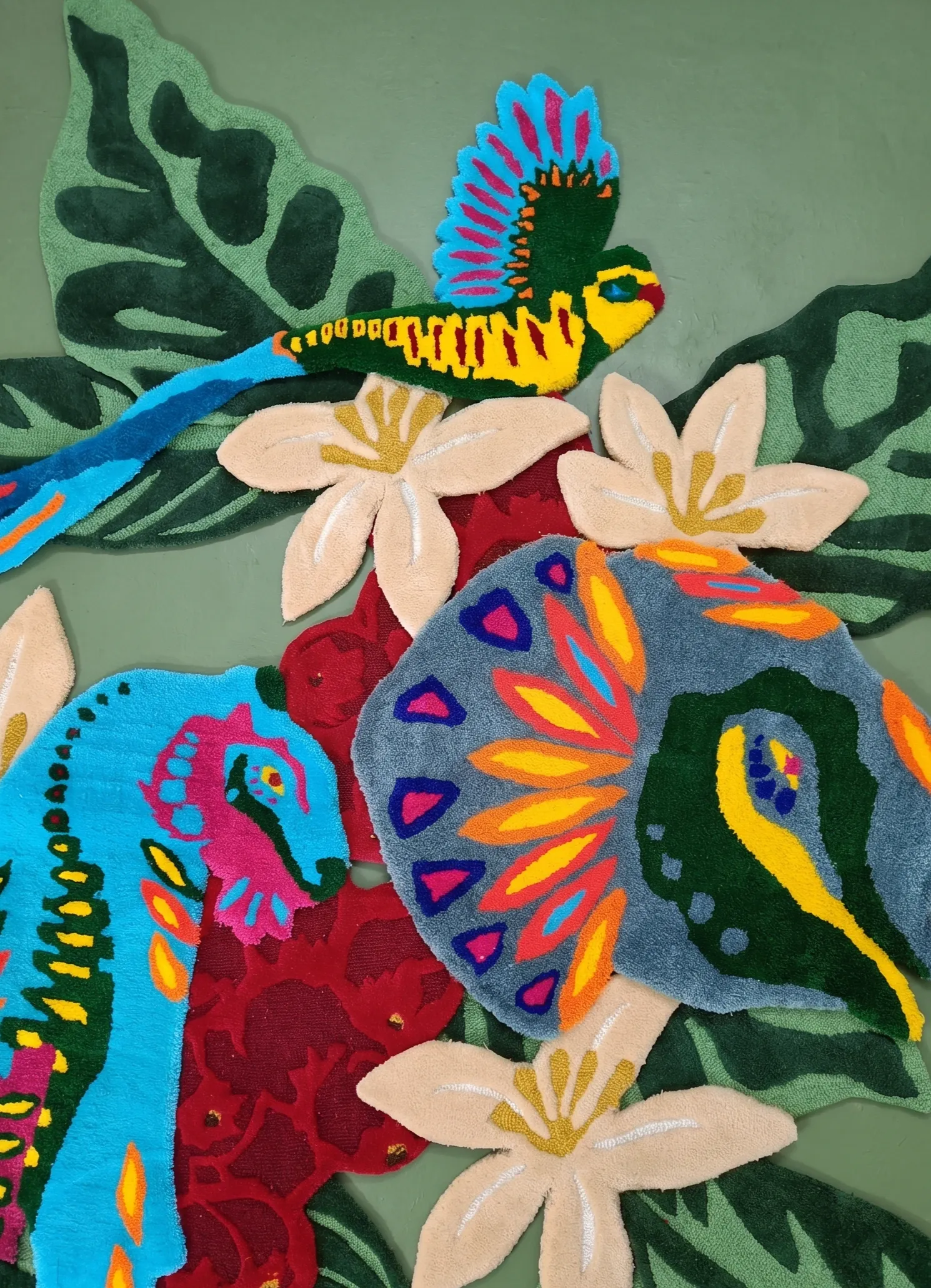 Detail of the hand-tufted woollen quetzal and tiger at Starbucks Rajpur Road, Dehradun